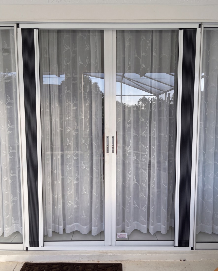 The same door with both halves fully stowed against the jambs