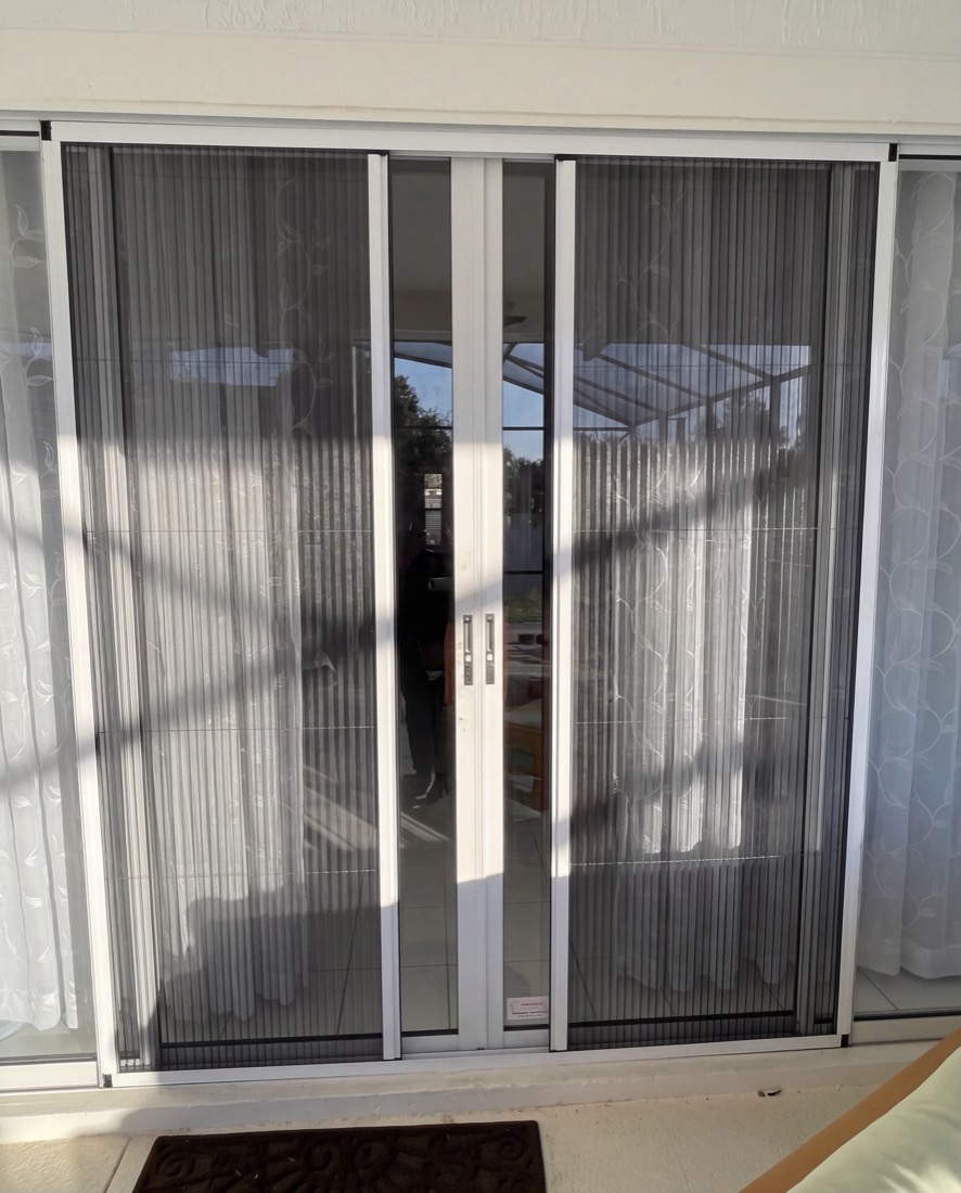 The same door with each half drawn part way and a clear gap left in the middle